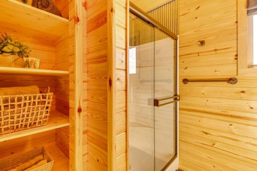 a sauna with a glass shower in a wooden cabin at Mountain Home Cabin Rental with Fire Pit! in Mountain Home