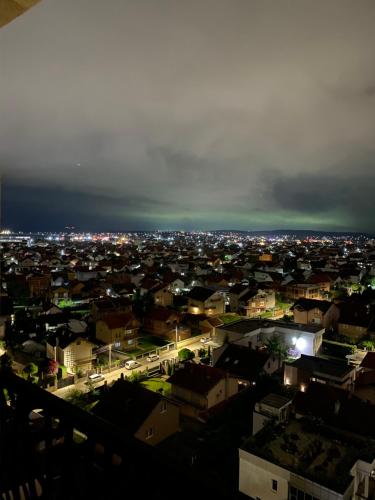 a view of a city at night with lights at Apartment for holidays in Ferizaj