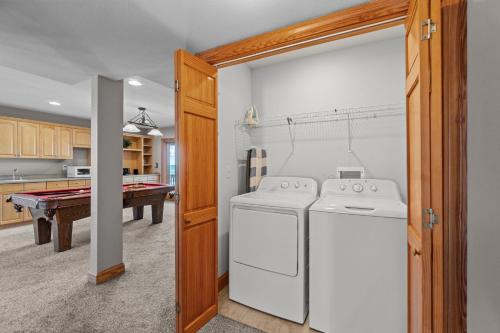 a kitchen with a washer and dryer in a room at 7042 - Whistling Oyster by Resort Realty in Rodanthe