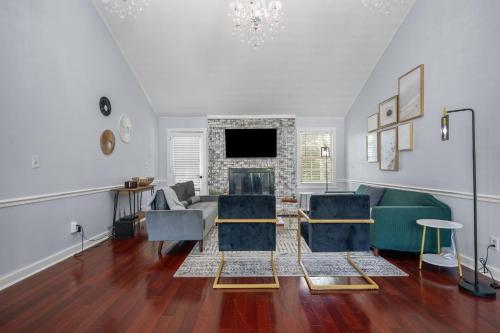 a living room with a couch and a fireplace at Gorgeous home in Lilburn in Lilburn