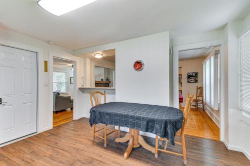 a living room with a table and a kitchen at Montour Falls Home 2 Mi to Seneca Lake and Wineries in Montour Falls