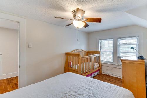 a bedroom with a crib and a ceiling fan at Montour Falls Home 2 Mi to Seneca Lake and Wineries in Montour Falls