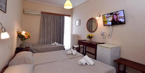 Una cama o camas en una habitación de Siagas Beach Hotel