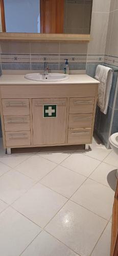 a bathroom with a sink and a toilet at Apartamento Solar dos Pinheiros in Vilamoura