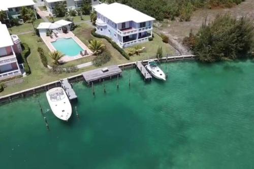 an aerial view of a house with boats in the water at Beautiful 3 Bed 3 & a half Bath Home with Pool & Dock Slip in Freeport