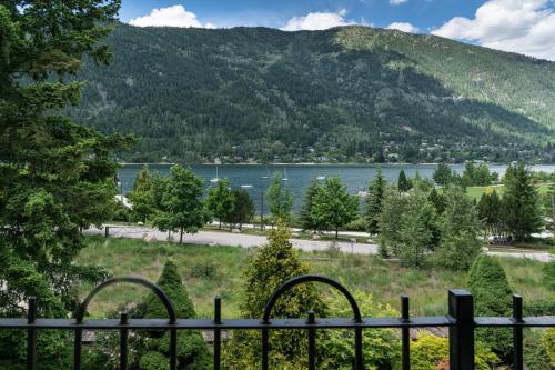 a view of a lake from a fence at Prestige Inn Nelson in Nelson