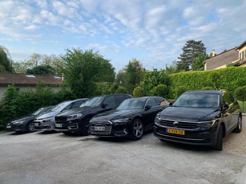 a row of parked cars parked in a parking lot at Lyon Mon Amour B&B in Lyon