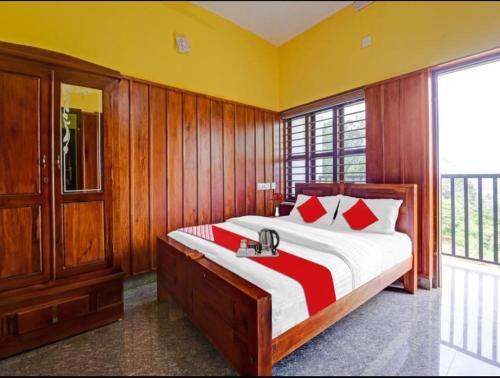 a bedroom with a large bed with wood paneling at Galaxy villa in Wayanad