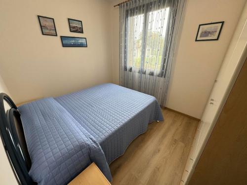 Ένα ή περισσότερα κρεβάτια σε δωμάτιο στο App4rent Residence Gaia 12 - in centro, con piscina, posto auto...