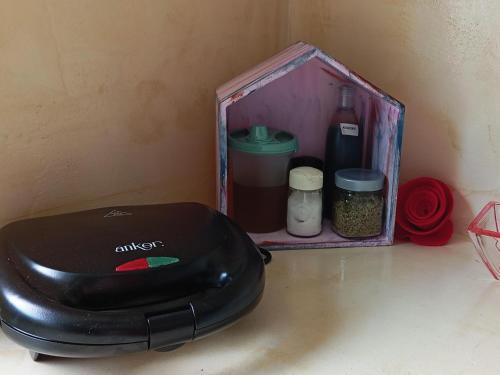 a toaster sitting on a counter next to a box at Katia 's Country House in Sikión