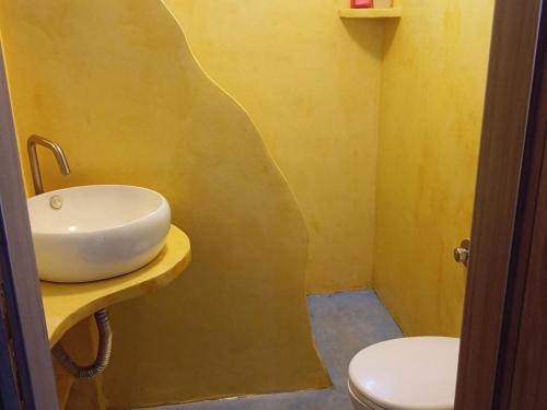 a bathroom with a sink and a toilet at Katia 's Country House in Sikión