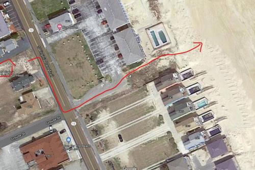 un mapa de un estacionamiento con una línea roja en 6812 Beach Rd, Semi Oceanfront, Pool, Hot Tub en Nags Head