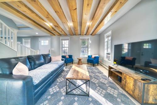 a living room with a couch and a table at New 3b House in Saugerties Village 4 mins to HITs in Saugerties