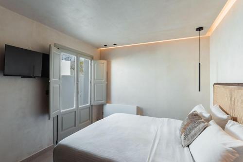 Кровать или кровати в номере Peranosa the Residency