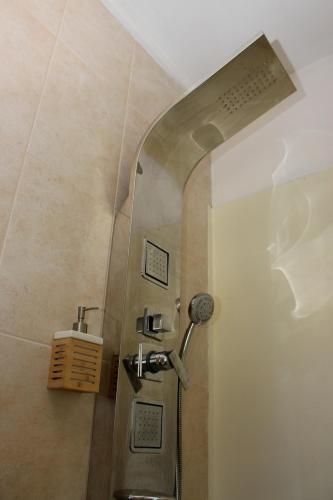 a shower stall with a sink in a bathroom at Casa do Artista in Vila Verde