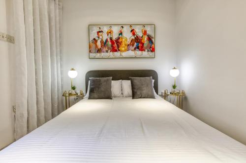 Postel nebo postele na pokoji v ubytování Stylish Valletta Suites