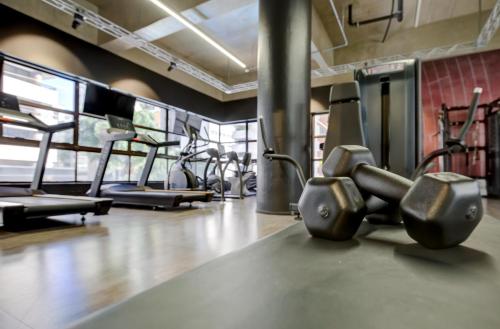 a gym with several cardio machines in a row at Radisson São Paulo Paulista in Sao Paulo