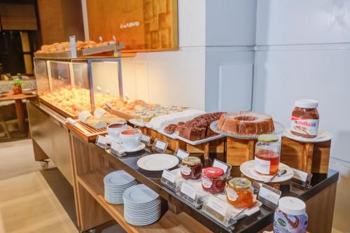 a buffet line with different types of food on display at Radisson São Paulo Paulista in Sao Paulo