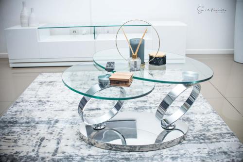 a glass coffee table on a rug in a kitchen at Guest House Auasblick by State House in Windhoek