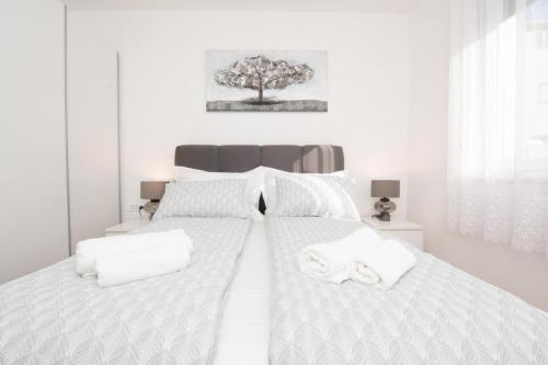 Postel nebo postele na pokoji v ubytování Studio Apartman Apollonia