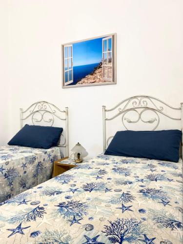 Ένα ή περισσότερα κρεβάτια σε δωμάτιο στο Oasi Salentorelax