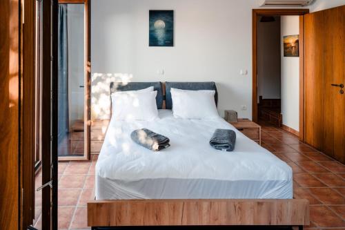 Postel nebo postele na pokoji v ubytování Poseidon Apartments