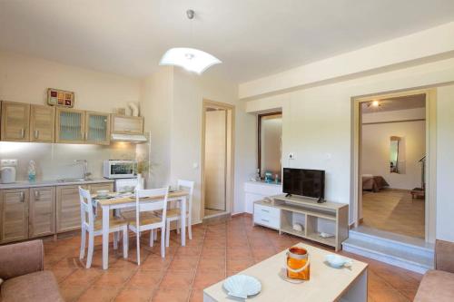 a living room with a kitchen and a dining room at VALENA STYLISH HOME (15 min TO ELAFONISI BEACH) in Élos