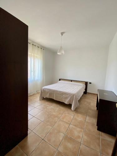 Ένα ή περισσότερα κρεβάτια σε δωμάτιο στο Casa vacanza Palinuro