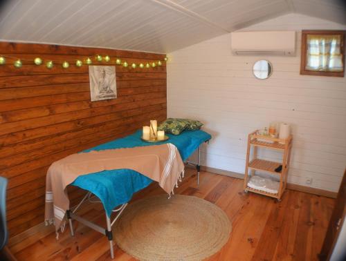 a room with two tables in the corner of a room at La Rose des Vents & Spa - Gite La Parenthèse in Néoules