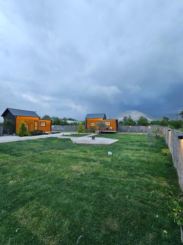 a view of a yard with houses in the background at ROOT TINY HOUSE KALKAN in Kas