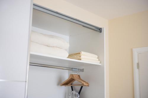 a towel rack in a bathroom with towels at Javorov list LUX in Šabac
