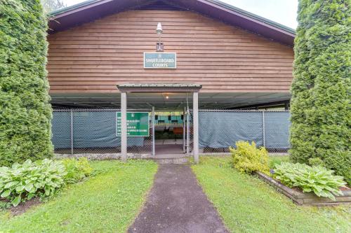 a large building with a gate in front of it at 9 Mi to Sugar Mountain Newland Cabin with Fire Pit! in Newland