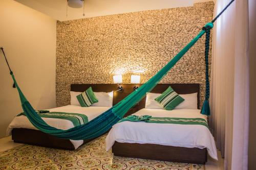 Ένα ή περισσότερα κρεβάτια σε δωμάτιο στο Hotel Marionetas