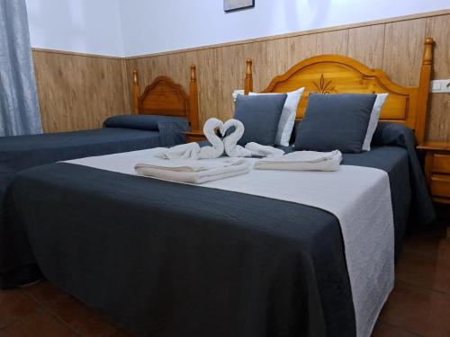 Postel nebo postele na pokoji v ubytování Hostal Breñaverde