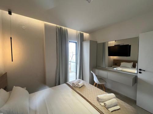 Кровать или кровати в номере Okkio Sea View
