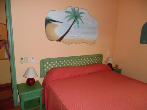Una cama o camas en una habitación de Hotel - Residencial Madrugada