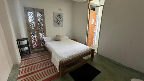 Säng eller sängar i ett rum på Cabaña Punta Coral