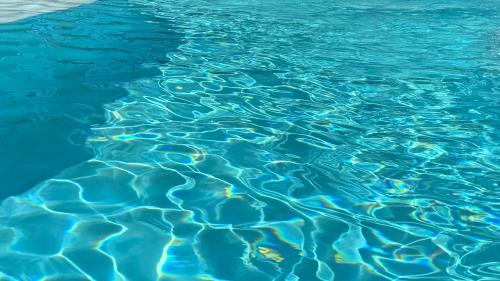 a close up of the water in a swimming pool at Ocean Luxe in Paradise - Le Paradis Royal in Rincon