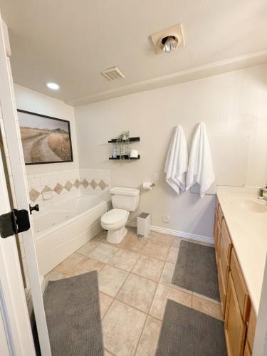 a bathroom with a toilet and a sink at City View Retreat 2 BR 1 B in Draper