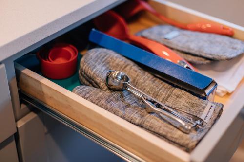 a drawer with a knife and a pair of scissors at City View Retreat 2 BR 1 B in Draper