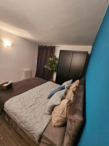 a bedroom with a large bed and a couch at Apartman Dea Brseč in Brseč