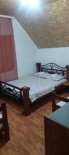 a bedroom with two bunk beds and a ceiling at Etno selo Šapat in Šavnik