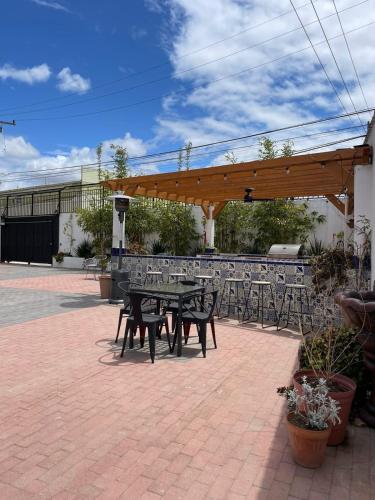 a picnic table and chairs in a patio at Villa Angel in Tijuana