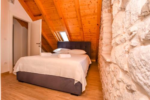 Giường trong phòng chung tại Villa Grgo