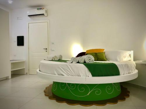 a bedroom with a large bed in a room at COCCIU D’AMURI in Castellammare del Golfo
