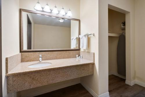 a bathroom with a sink and a mirror at Hotel Americana in Nogales