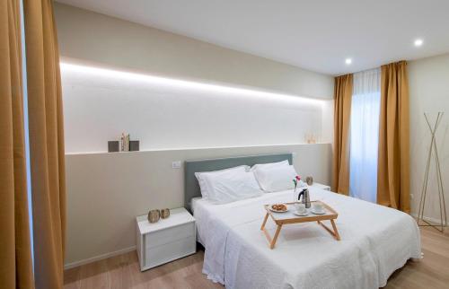 Ліжко або ліжка в номері Residence Casa Coppa Appartamento Aster