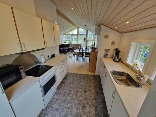 a kitchen with a sink and a counter top at Holiday house by a fantastic beach and free WiFi in Slagelse