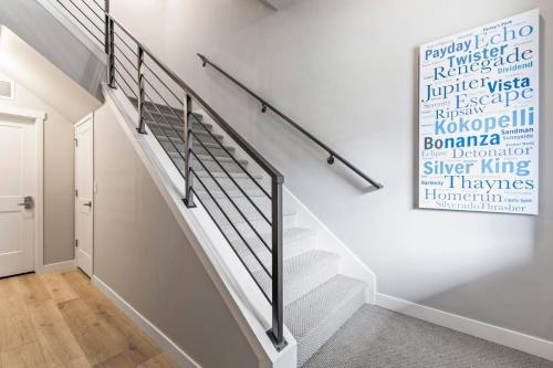 a staircase in a house with a mural on the wall at Deer Springs 12754 by Moose Management in Keetley