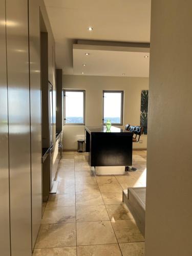 an office with a desk in the middle of a hallway at The Franklin Luxury Apartments in Johannesburg
